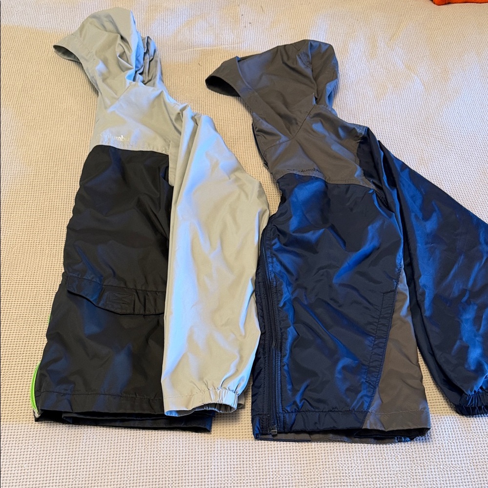 Two Columbia Kids' Two-Tone Rain Jackets in Light Gray/Black and Navy/Gray